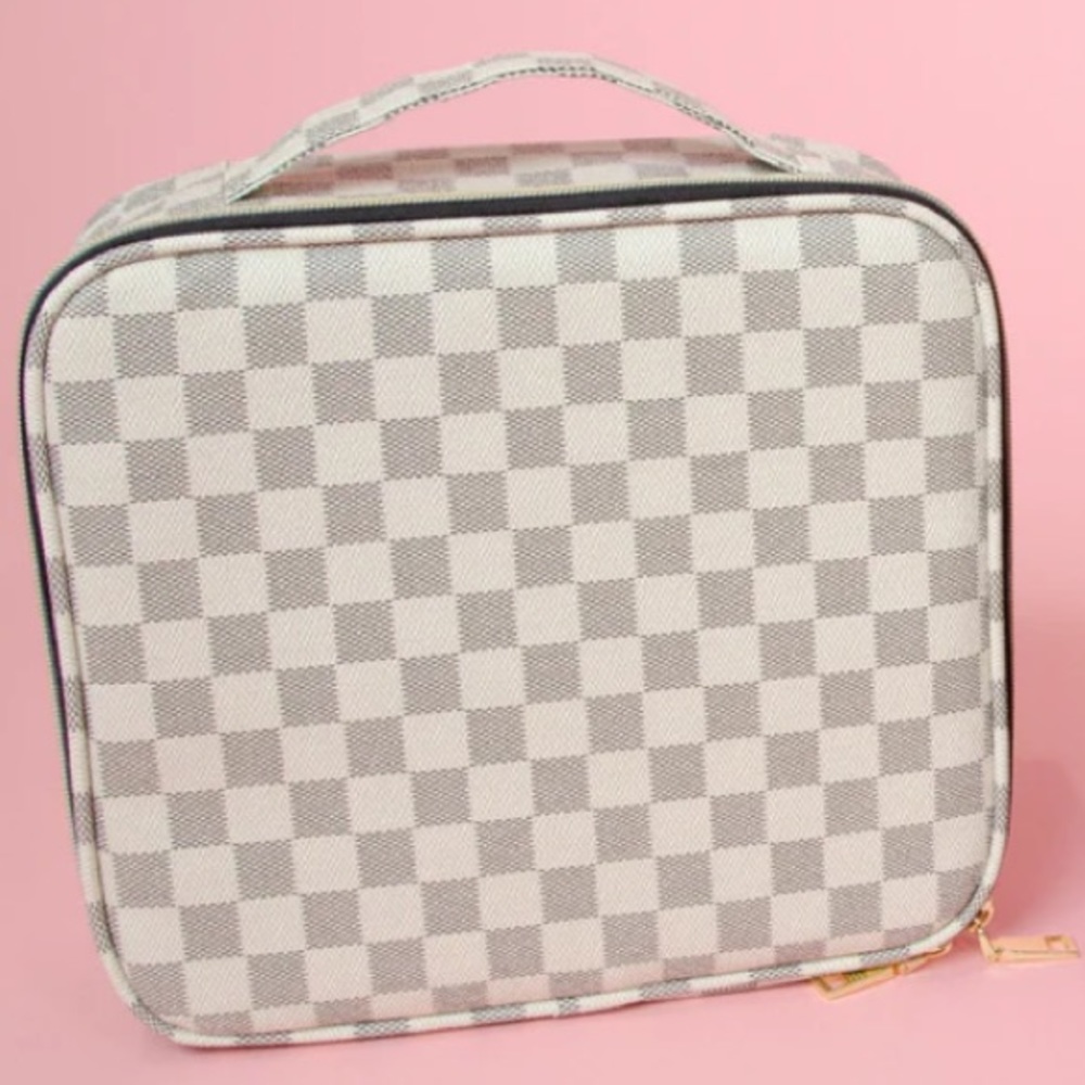 Cream checkered makeup case.  Outside zipper and handle. New, never used